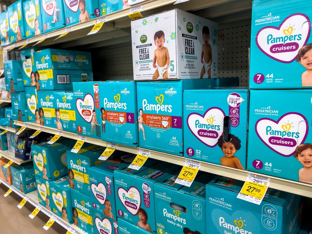 shelves of diapers for sale in a store